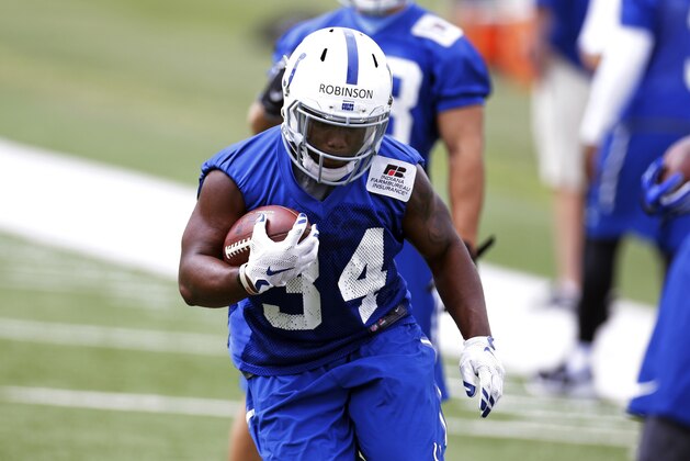 Indianapolis Colts running back Josh Robinson runs a drill during an NFL football organized team activity at the NFL team's practice facility in Indianapolis, Wednesday, June 3, 2015.  (AP Photo/Michael Conroy)