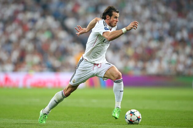 MADRID, SPAIN - MAY 13:  Gareth Bale of Real Madrid CF runs with the ball during the UEFA Champions League Semi Final second leg match between Real Madrid CF and Juventus at Estadio Santiago Bernabeu on May 13, 2015 in Madrid, Spain.  (Photo by Alex Livesey/Getty Images)