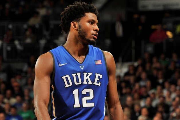 Duke guard Justise Winslow, left, talks with coach Mike Krzyzewski in the an NCAA college basketball game with Notre Dame Wednesday, Jan. 28, 2015, in South Bend, Ind. Notre Dame won 77-73 . (AP Photo/Joe Raymond)