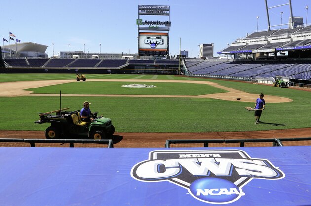 Groundscrew work at TD Ameritrade Park, home of the NCAA baseball College World Series in Omaha, Neb., Wednesday, June 10, 2015. Final preparations are being made for the start of the College World Series this weekend, with grounds crew manicuring the field in downtown Omaha. (AP Photo/Nati Harnik)