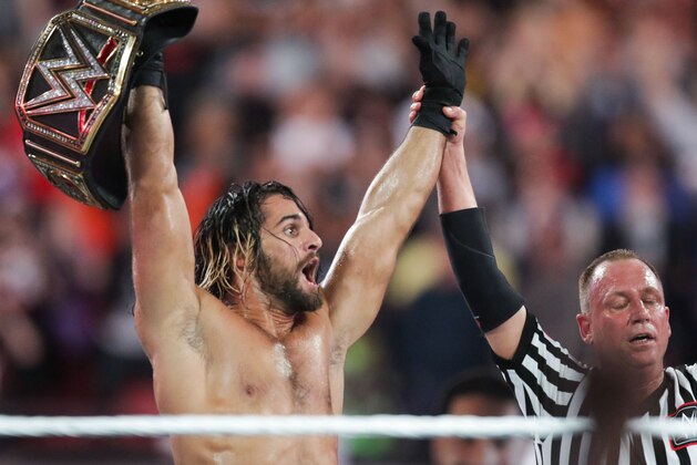 WWE Superstar Seth Rollins celebrates becoming the new WWE World Heavyweight Champion at WrestleMania 31 at Levi's Stadium on Sunday, March 29, 2015 in Santa Clara, CA. WrestleMania broke the Levi’s Stadium attendance record at 76,976 fans from all 50 states and 40 countries. (Don Feria/AP Images for WWE)