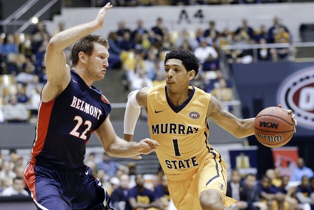 Murray State guard Cameron Payne (1) drives against Belmont guard Reece Chamberlain (22) during the first half of an NCAA college basketball game in the final of the Ohio Valley Conference tournament Saturday, March 7, 2015, in Nashville, Tenn. (AP Photo/Mark Humphrey)