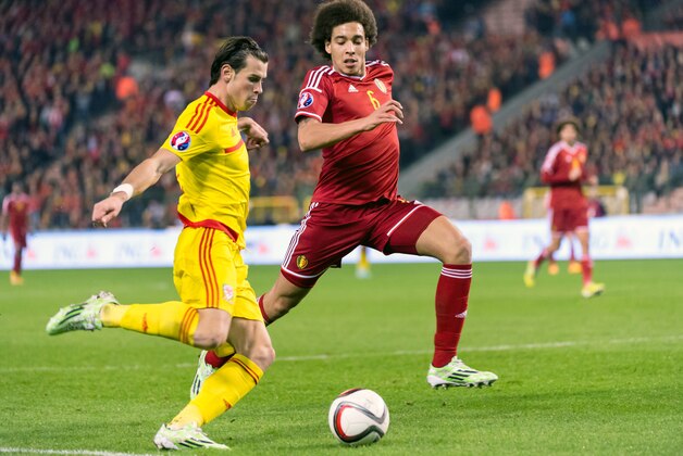 Belgium's Axel Witsel, right, challenges Wales' Gareth Bale during their Euro 2016 qualifying match in group B at the King Baudouin stadium in Brussels, Sunday, Nov. 16, 2014. (AP Photo/Geert Vanden Wijngaert)