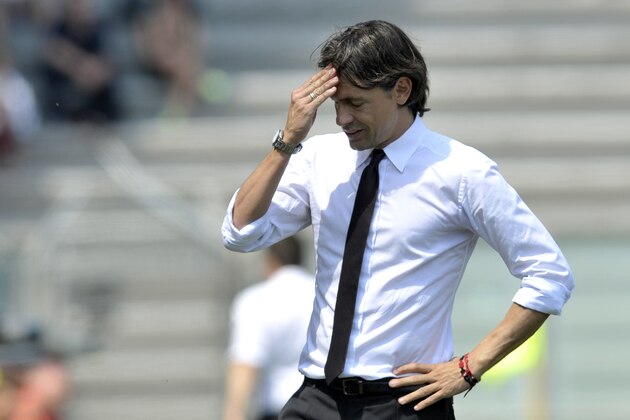 AC Milan coach Filippo Inzaghi touches his forehead during a Serie A soccer match between Sassuolo and AC Milan at Reggio Emilia's Mapei stadium, Italy, Sunday, May 17, 2015. (AP Photo/Marco Vasini)
