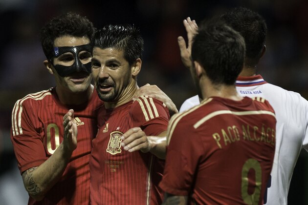 LEON, SPAIN - JUNE 11:  Cesc Fabregas (L) celebrates scoring their second goal with teammate Manuel Duran during the international friendly match between Spain and Costa Rica at Reino de Leon Stadium on June 11, 2015 in Leon, Spain.  (Photo by Gonzalo Arroyo Moreno/Getty Images)