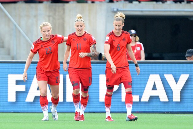 Jun 11, 2015; Ottawa, Ontario, CAN; Germany forward Anja Mittag (11) is congratulated by midfielder Tabea Kemme (22) and midfielder Simone Laudehr (6) after scoring a goal against Norway in the first half of a Group B soccer match in the 2015 FIFA women's World Cup at Lansdowne Stadium. Mandatory Credit: Marc DesRosiers-USA TODAY Sports