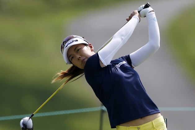 Jenny Shin, of South Korea, tees off the ninth hole during the first round of the KPMG Women's PGA golf championship at Westchester Country Club, Thursday, June 11, 2015, in Harrison, N.Y. (AP Photo/Julio Cortez)