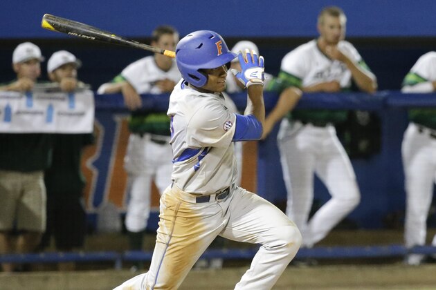 Florida's Richie Martin hits against South Florida in an NCAA college baseball tournament regional game, Saturday, May 30, 2015, in Gainesville, Fla. Florida won 8-2.  (AP Photo/John Raoux)