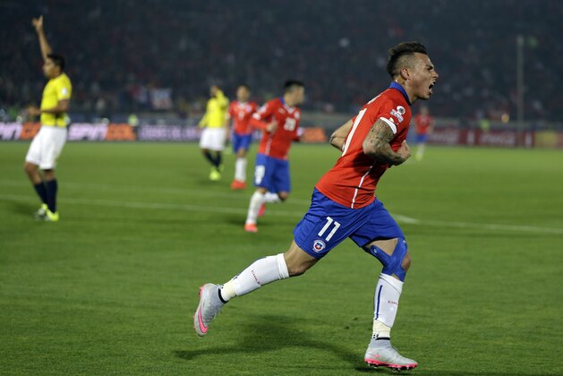 Chile's Eduardo Vargas celebrates after scoring against Ecuador during a Copa America Group 1 soccer match at the National Stadium in Santiago, Chile, Thursday, June 11, 2015. (AP Photo/Natacha Pisarenko)