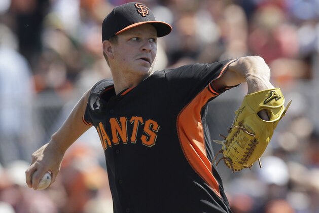 San Francisco Giants' Matt Cain works against the Los Angeles Dodgers in the first inning of a spring training exhibition baseball game Sunday, March 29, 2015, in Scottsdale, Ariz. (AP Photo/Ben Margot)