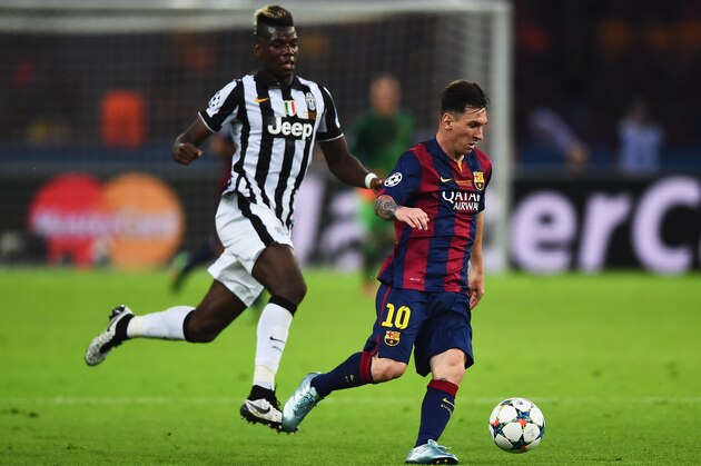 BERLIN, GERMANY - JUNE 06: Lionel Messi of Barcelona goes past Paul Pogba of Juventus during the UEFA Champions League Final between Juventus and FC Barcelona at Olympiastadion on June 6, 2015 in Berlin, Germany.  (Photo by Laurence Griffiths/Getty Images)