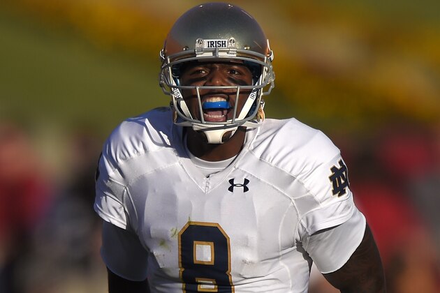 Notre Dame quarterback Malik Zaire yells to his team during the second half an NCAA college football game against Southern California, Saturday, Nov. 29, 2014, in Los Angeles. Southern California won 49-14. (AP Photo/Mark J. Terrill)