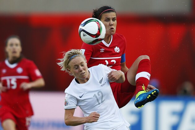 EDMONTON, AB - JUNE 11: Christine Sinclair (R) of Canada and Betsy Hassett of New Zealand battle for the ball during the FIFA Women's World Cup Canada Group A match between Canada and New Zealand at Commonwealth Stadium on June 11, 2015 in Edmonton, Alberta, Canada.  (Photo by Todd Korol/Getty Images)