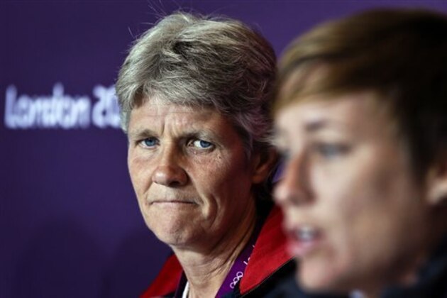 United States head coach Pia Sundhage, left, listens as Abby Wambach speaks during a women's soccer news conference for the 2012 Summer Olympics, Sunday, Aug. 5, 2012, at Old Trafford in Manchester, England. (AP Photo/Ben Curtis)