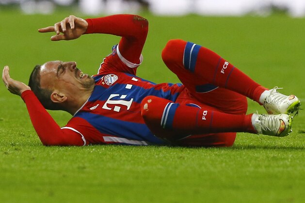 Bayern's Franck Ribery grimaces after a collision during the Champions League round of 16 second leg soccer match between Bayern Munich and Shakhtar Donetsk Wednesday, March 11, 2015 in Munich, southern Germany. (AP Photo/Matthias Schrader)