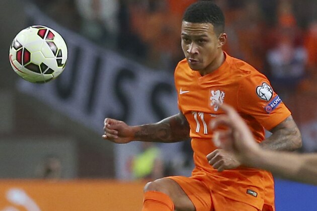 Netherlands' Memphis Depay plays the ball during the Euro 2016 group A qualifying soccer match between the Netherlands and Turkey at Arena stadium in Amsterdam, Netherlands, Saturday, March 28, 2015. (AP Photo/Peter Dejong)