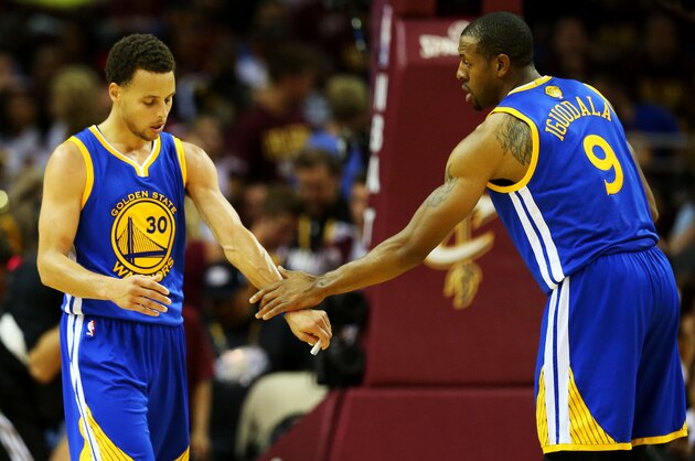CLEVELAND, OH - JUNE 11:  Stephen Curry #30 Andre Iguodala #9 of the Golden State Warriors talk in the second half against the Cleveland Cavaliers and during Game Four of the 2015 NBA Finals at Quicken Loans Arena on June 11, 2015 in Cleveland, Ohio.  NOTE TO USER: User expressly acknowledges and agrees that, by downloading and or using this photograph, user is consenting to the terms and conditions of Getty Images License Agreement.  (Photo by Ronald Martinez/Getty Images)