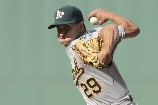 Oakland Athletics relief pitcher Pat Venditte winds up for a pitch against the Boston Red Sox in the eighth inning of a baseball game, Sunday, June 7, 2015, in Boston. The Red Sox won 7-4. (AP Photo/Steven Senne)