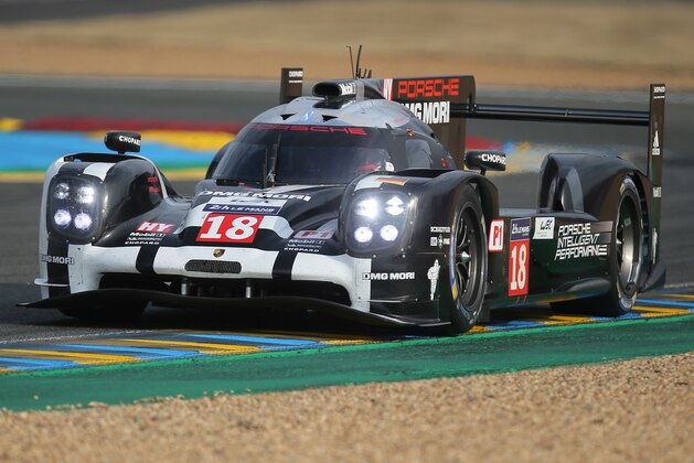 The Porsche 919 Hybrid No18 of the Porsche Team driven by Romain Dumas of France, Neel Jani of Switzerland and Marc Lieb of Germany in action during the second qualifying practice session of the 83rd 24-hour Le Mans endurance race, in Le Mans, western France, Thursday, June 11, 2015. The race will begin on Saturday, June 13. (AP Photo/David Vincent)
