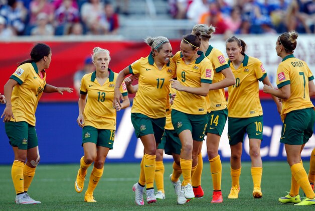 Jun 12, 2015; Winnipeg, Manitoba, CAN; Australia forward Kyah Simon (17) is congratulated by forward Caitlin Foord (9) after scoring against Nigeria during the second half in a Group D soccer match in the 2015 FIFA women's World Cup at Winnipeg Stadium. Mandatory Credit: Michael Chow-USA TODAY Sports
