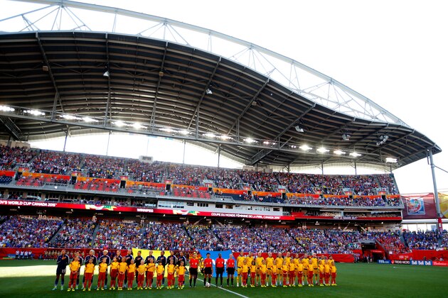 WINNIPEG, MB - JUNE 12:  Sweden and the United States stand during the anthems before the FIFA Women's World Cup Canada 2015 match at Winnipeg Stadium on June 12, 2015 in Winnipeg, Canada.  (Photo by Kevin C. Cox/Getty Images)