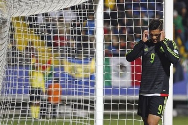 Mexico's Raul Jimenez reacts after missing a chance to score during a Copa America Group A soccer match against Bolivia at the Sausalito Stadium in Vina del Mar, Chile, Friday, June 12, 2015. (AP Photo/Silvia Izquierdo)