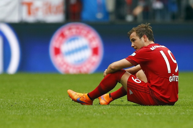 Bayern's Mario Goetze sits on the ground after the German first division Bundesliga soccer match between FC Bayern Munich and FC Augsburg at the Allianz Arena in Munich, Germany, on Saturday, May 9, 2015. (AP Photo/Matthias Schrader)