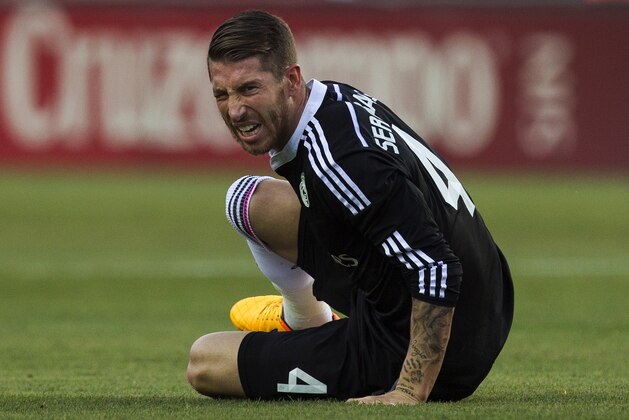 Real Madrid's Sergio Ramos gestures after a foul, during a Spanish La Liga soccer match between Sevilla and Real Madrid at the Ramon Sanchez Pizjuan stadium in Sevilla, Spain, Saturday, May 2, 2015. (AP Photo/Andres Kudacki)