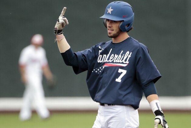 Vanderbilt's Dansby Swanson celebrates on second base after hitting a double against Radford in the first inning of an NCAA regional college baseball game Monday, June 1, 2015, in Nashville, Tenn. (AP Photo/Mark Humphrey)
