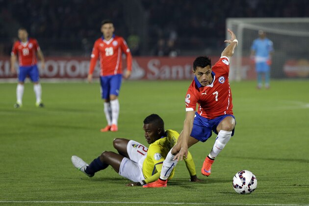 Chile's Alexis Sanchez controls the ball past Ecuador's Gabriel Achilier  during a Copa America Group 1 soccer match at the National Stadium in Santiago, Chile, Thursday, June 11, 2015.(AP Photo/Natacha Pisarenko)