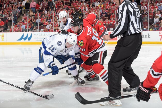 CHICAGO, IL - JUNE 08:  Ondrej Palat #18 of the Tampa Bay Lightning and Jonathan Toews #19 of the Chicago Blackhawks face off during Game Three of the 2015 NHL Stanley Cup Final at the United Center on June 8, 2015 in Chicago, Illinois.  (Photo by Bill Smith/NHLI via Getty Images)