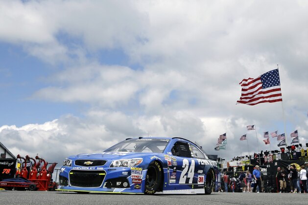 Jeff Gordon (24) drives through the garage area at Pocono Raceway during practice for Sunday's NASCAR Sprint Cup Series auto race in Long Pond, Pa., Saturday, June 6, 2015. (AP Photo/Mel Evans)