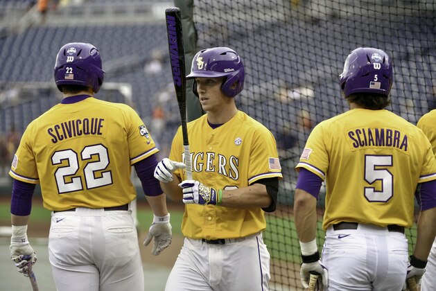 LSU's Kade Scivicque (22), Alex Bregman, center, and Chris Sciambra (5) take turns during batting practice in Omaha, Neb., Friday, June 12, 2015. LSU is to play TCU in an NCAA College World Series baseball game on Sunday. (AP Photo/Mike Theiler)