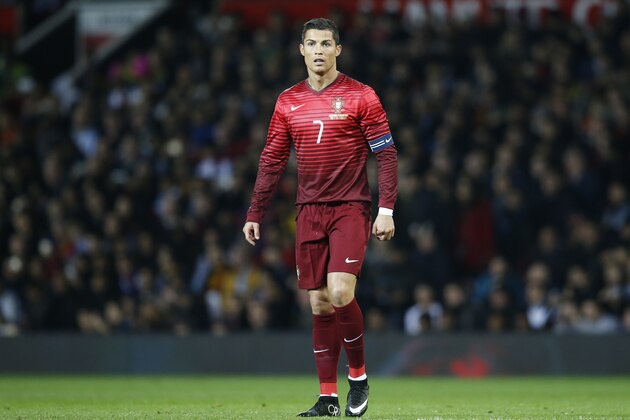 Cristiano Ronaldo of Portugal is seen during his team's International Friendly soccer match against Argentina at Old Trafford Stadium, Manchester, England, Tuesday Nov. 18, 2014. (AP Photo/Jon Super)