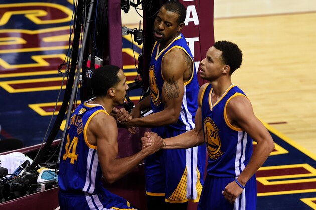 CLEVELAND, OH - JUNE 11:  Andre Iguodala #9 and Stephen Curry #30 help Shaun Livingston #34 of the Golden State Warriors to his feet during Game Four of the 2015 NBA Finals against the Cleveland Cavaliers at Quicken Loans Arena on June 11, 2015 in Cleveland, Ohio.  NOTE TO USER: User expressly acknowledges and agrees that, by downloading and or using this photograph, user is consenting to the terms and conditions of Getty Images License Agreement.  (Photo by Jason Miller/Getty Images)