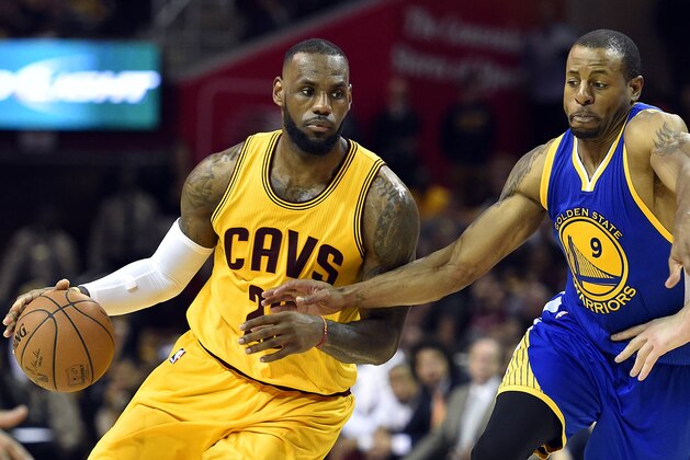 Jun 11, 2015; Cleveland, OH, USA; Cleveland Cavaliers forward LeBron James (23) drives to the basket against Golden State Warriors guard Andre Iguodala (9) during the fourth quarter in game four of the NBA Finals at Quicken Loans Arena. Mandatory Credit: Bob Donnan-USA TODAY Sports
