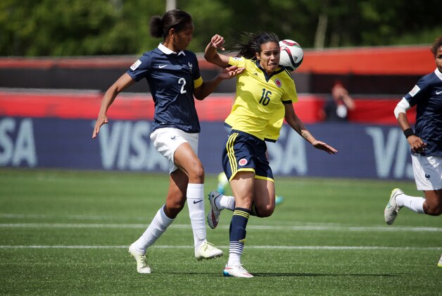Jun 13, 2015; Moncton, New Brunswick, CAN; France defender Wendie Renard (2) and Colombia forward Lady Andrade (16) battle for the ball during the second half in a Group F soccer match in the 2015 FIFA women's World Cup at Moncton Stadium. Mandatory Credit: Matt Kryger-USA TODAY Sports