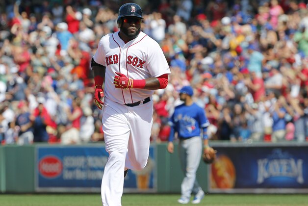 Boston Red Sox designated hitter David Ortiz rounds the bases after hitting a solo home run against the Toronto Blue Jays during the sixth inning of a baseball game at Fenway Park in Boston Saturday, June 13, 2015. (AP Photo/Winslow Townson)