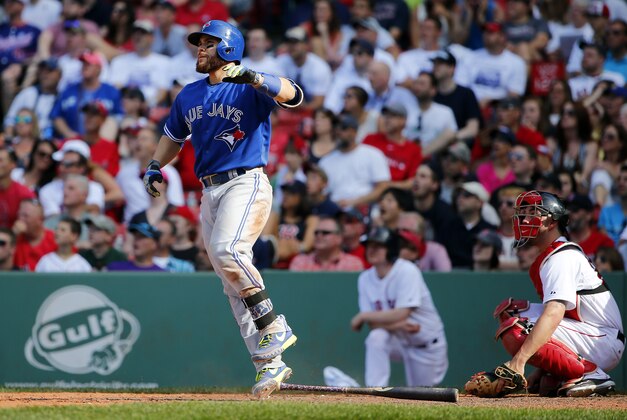 Toronto Blue Jays' Russell Martin watches his solo home run against the Boston Red Sox during the 11th inning of a baseball game at Fenway Park in Boston Saturday, June 13, 2015. (AP Photo/Winslow Townson)