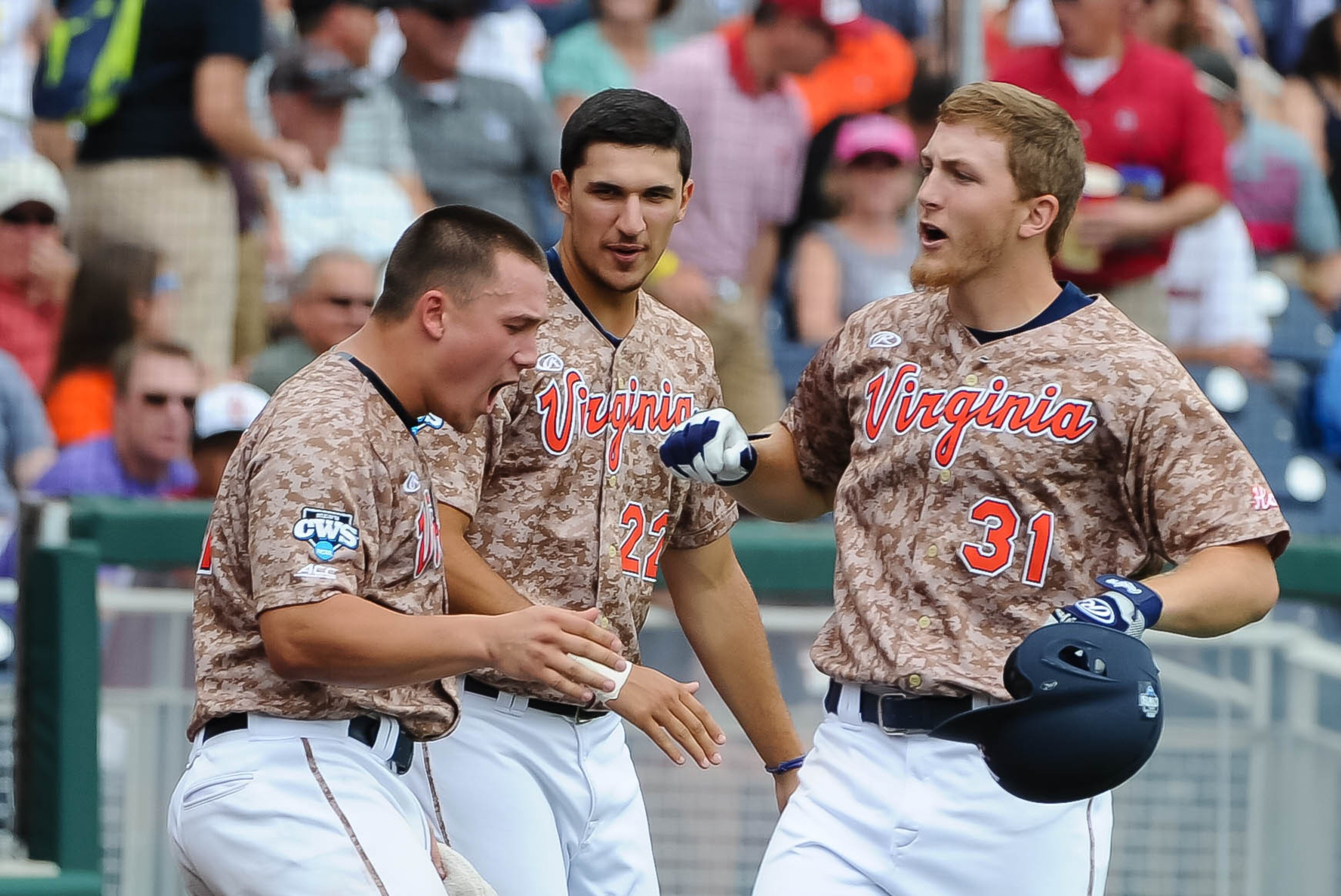 Jun 13, 2015; Omaha, NE, USA; Virginia Commodores outfielder Joe McCarthy (31) celebrates with teammates after a home run in the second inning against the Arkansas Razorbacks in the 2015 College World Series at TD Ameritrade Park. Mandatory Credit: Steven Branscombe-USA TODAY Sports