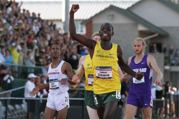 Oregon's Edward Cheserek fist-pumps after winning the men's 5000-meter run during the NCAA track and field championships in Eugene, Ore., Friday, June 12, 2015. (AP Photo/Ryan Kang)