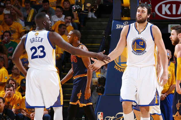OAKLAND, CA - JUNE 7: Teammates Draymond Green #23 of the Golden State Warriors and Andrew Bogut #12 of the Golden State Warriors high-five during Game Two of the 2015 NBA Finals on June 7, 2015 at Oracle Arena in Oakland, California. NOTE TO USER: User expressly acknowledges and agrees that, by downloading and or using this photograph, user is consenting to the terms and conditions of Getty Images License Agreement. Mandatory Copyright Notice: Copyright 2015 NBAE (Photo by Nathaniel S. Butler/NBAE via Getty Images)