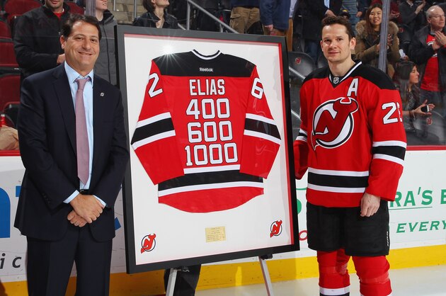 NEWARK, NJ - FEBRUARY 09: Patrik Elias #26 of the New Jersey Devils and Devils co-owner David Blitzer pose for a photo with a framed jersey commemorating Elias's milestones prior to the game against the Edmonton Oilers at the Prudential Center on February 9, 2015 in Newark, New Jersey. (Photo by Andy Marlin/NHLI via Getty Images) NEWARK, NJ - FEBRUARY 09: Patrik Elias #26 of the New Jersey Devils and Devils co-owner David Blitzer pose for a photo with a framed jersey commemorating Elias's milestones prior to the game against the Edmonton Oilers at the Prudential Center on February 9, 2015 in Newark, New Jersey. (Photo by Andy Marlin/NHLI via Getty Images)