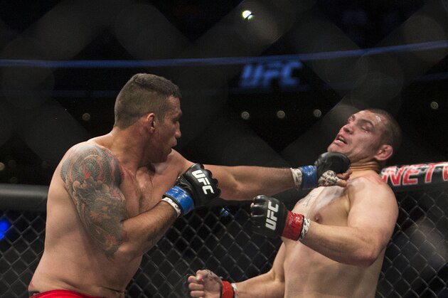 United States' Cain Velasquez, right, battles against Brazil's Fabricio Werdum during a men's heavyweight title mixed martial arts bout at UFC 188 in Mexico City, Saturday, June  13, 2015. Werdum won the fight by submission. (AP Photo/Christian Palma)