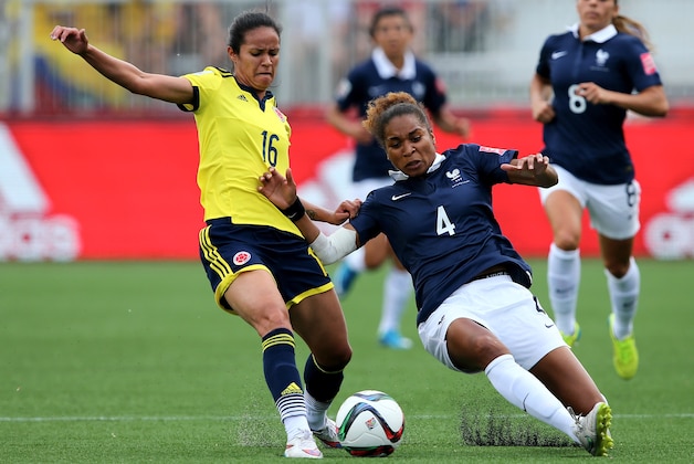 MONCTON, NB - JUNE 13:  Lady Andrade #16 of Colombia and Laura Georges #4 of France fight for the ball during the FIFA Women's World Cup 2015 Group F match at Moncton Stadium on June 13, 2015 in Moncton, Canada.  (Photo by Elsa/Getty Images)