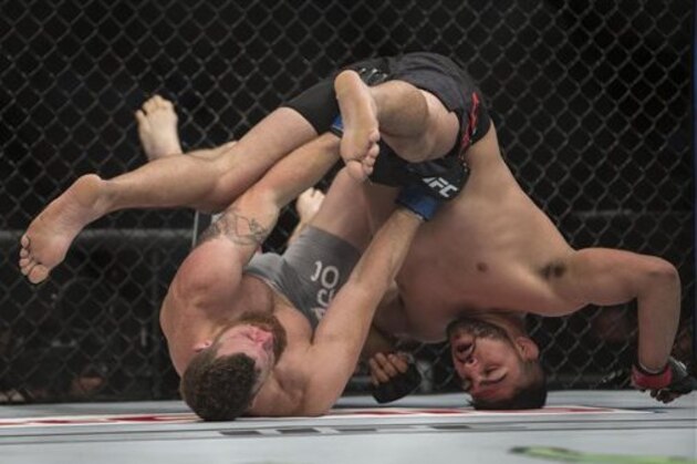 Nate Marquardt, left, battles against Kelvin Gastelum during a men's middleweight UFC 188 mixed martial arts bout in Mexico City, Saturday, June  13, 2015. Gastelum won the fight by submission. (AP Photo/Christian Palma)
