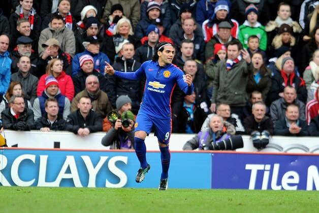 Manchester United's Radamel Falcao celebrates after scoring during their English Premier League soccer match against Stoke City at the Britannia Stadium in Stoke on Trent, England, Thursday Jan. 1, 2015. (AP Photo/Clint Hughes)