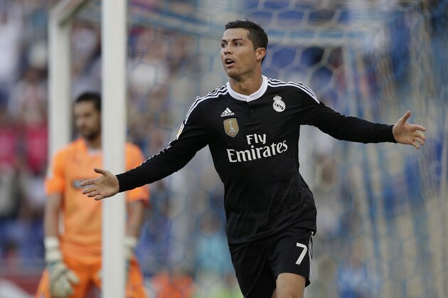 Real Madrid's Cristiano Ronaldo, from Portugal, reacts after scoring against Espanyol during a Spanish La Liga soccer match at Cornella-El Prat stadium in Cornella Llobregat, Spain, Sunday, May 17, 2015. (AP Photo/Manu Fernandez)