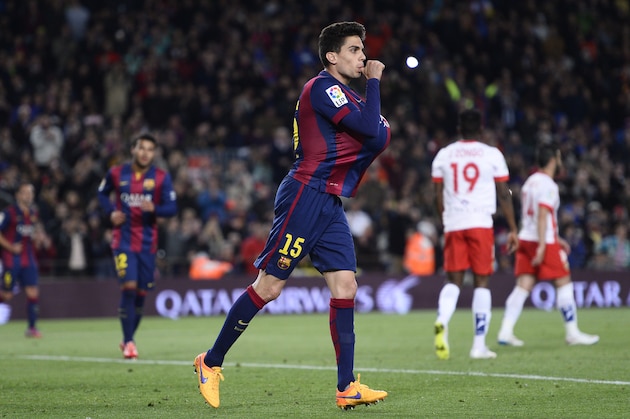 FC Barcelona's Marc Bartra celebrates after scoring against Almeria during a Spanish La Liga soccer match at the Camp Nou stadium in Barcelona, Spain, Wednesday, April 8, 2015. (AP Photo/Manu Fernandez)