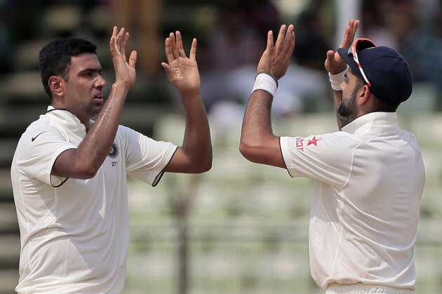 India’s Ravichandran Ashwin, left, celebrates with captain Virat Kohli after the dismissal of Bangladesh’s Shuvagata Hom on the last day of the test cricket match between them in Fatullah, Bangladesh, Sunday, June 14, 2015. (AP Photo/A.M. Ahad) India’s Ravichandran Ashwin, left, celebrates with captain Virat Kohli after the dismissal of Bangladesh’s Shuvagata Hom on the last day of the test cricket match between them in Fatullah, Bangladesh, Sunday, June 14, 2015. (AP Photo/A.M. Ahad)
